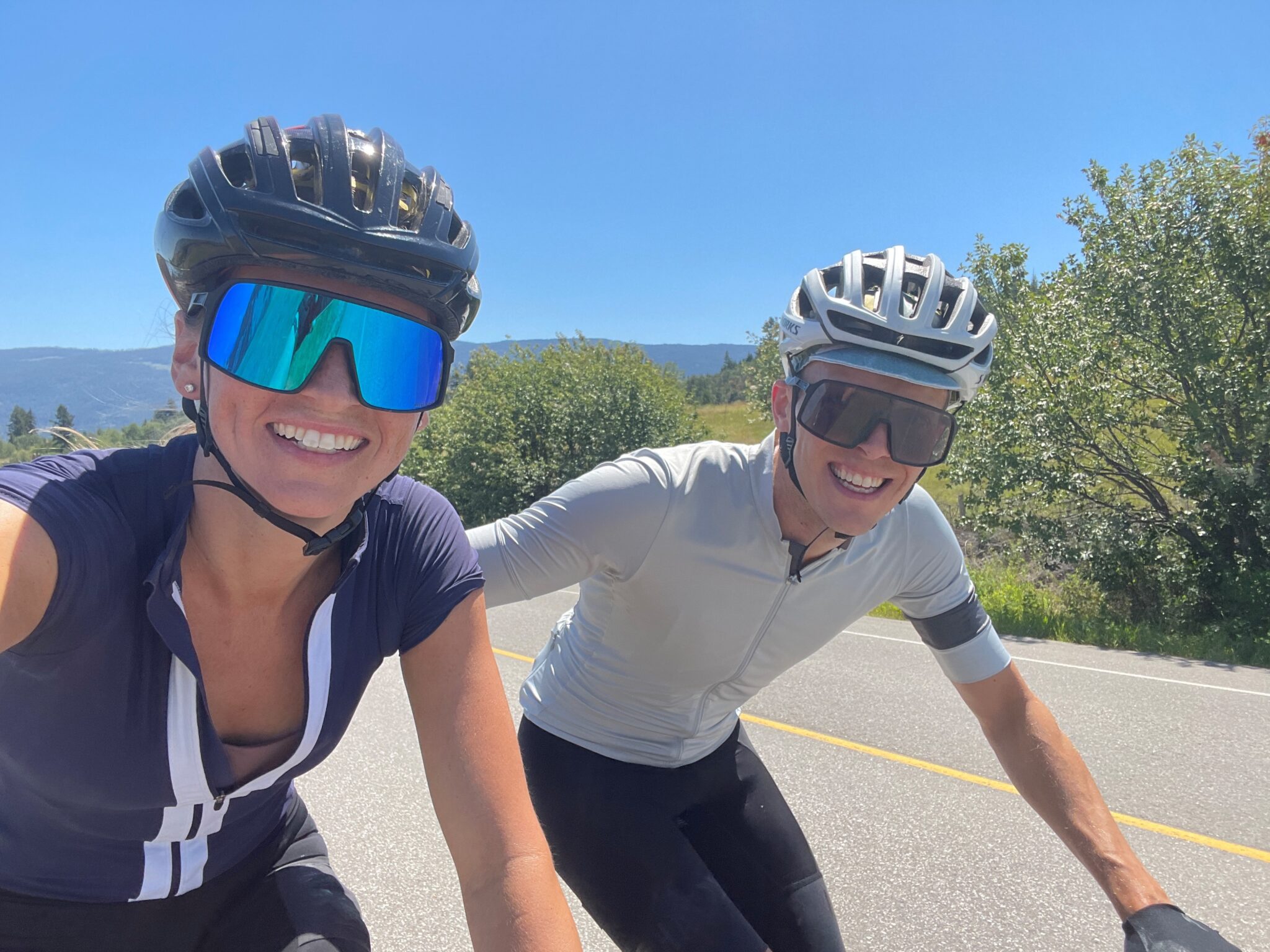A photo of David and his wife Marit biking together on a road.