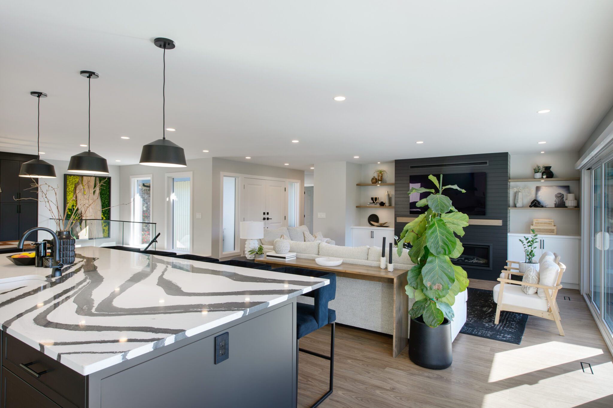 View of living room from behind the marbled quartz kitchen island countertop